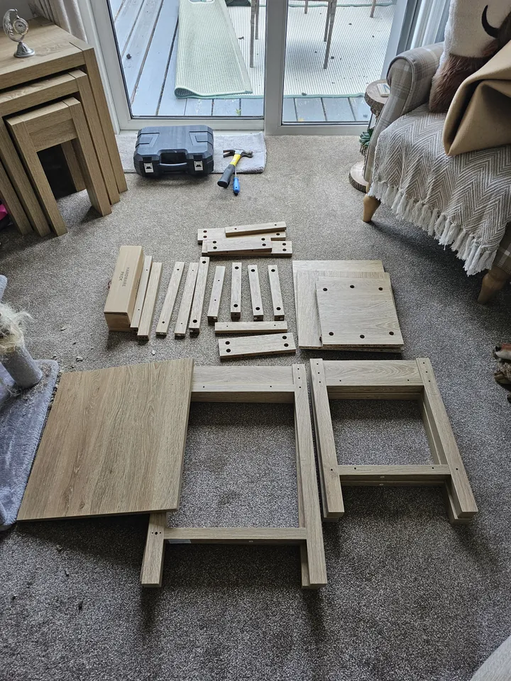 Dunelm Olney nest of tables being assembled in a customer's living room in Ballyclare